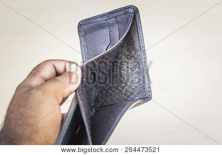 Black Wallet Closed Open, But Without Any Money. Light Background