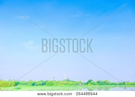 View Of Beautiful Clouds Sky With Meadow Green Tree And Plain Landscape Use For Wallpaper And Backdr