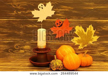 Halloween. Bright Pumpkins Of Unusual Shape, Black Metal Lantern And Funny Ghosts On Dark Wooden Bac