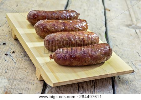 Grilled Sausages On Cutting Board