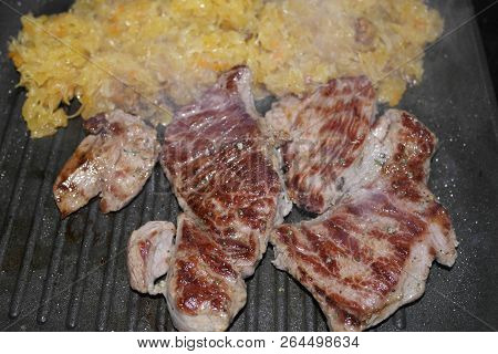 Roasted Beef Steak With Sauted Sour Cabbage