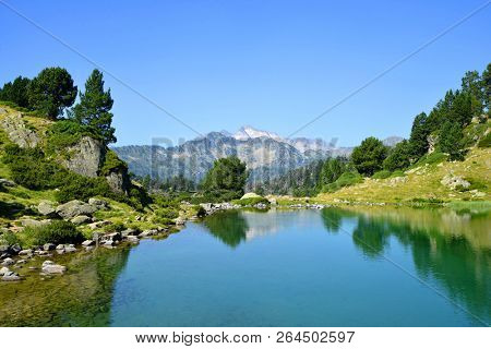 Beautiful mountain landscape in Neouvielle national nature reserve, Lac de Bastan inferieur, French Pyrenees.