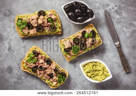 Bruschetta With Tuna, Olives And Avocade Spread.