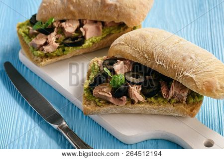 Bruschetta With Tuna, Olives And Avocade Spread.