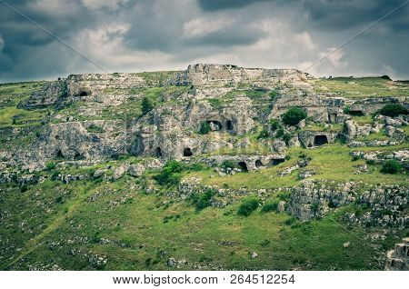 View Of Ravine Canyon With Rocks And Houses In Caves Di Murgia Timone Near Old Ancient Town Matera (