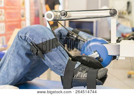 Simulator For Leg Rehabilitation. Rehabilitation Of Injured Limbs. Mannequin In The Apparatus For Tr