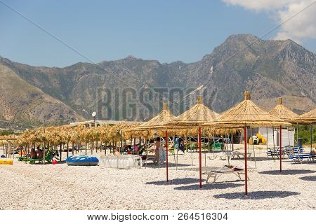 Borsh, Albania- 29 June 2014: Sunbathers On The Beach In Borsh Resort. Stony Beach On The Adriatic S