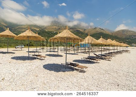 Borsh, Albania- 29 June 2014: Sunbathers On The Beach In Borsh Resort. Stony Beach On The Adriatic S