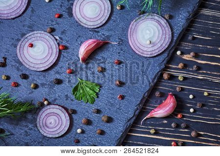 A Composition Of Garlic, Onion And Pepper