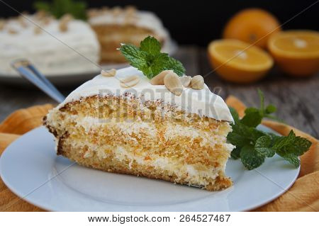 Orange And Carrotn Cake, Wooden Background. Rustic Style.