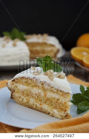 Orange And Carrotn Cake, Wooden Background. Rustic Style.