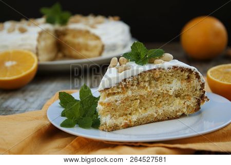Orange And Carrotn Cake, Wooden Background. Rustic Style.