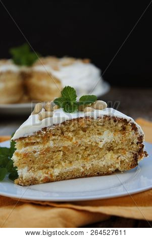 Orange And Carrot Piece Of Cake, Wooden Background. Rustic Style.