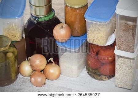 Storage Shelves In Pantry With Homemade Canned Preserved Fruits And Vegetables