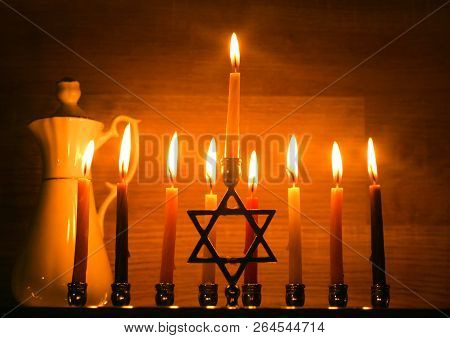 Hanukkah Is A Jewish Holiday. Burning Chanukah Candlestick With Candles. Jug Of Oil. Chanukiah Menor