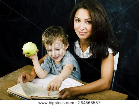 Little Cute Boy Pupil With Young Real Teacher, Classroom Studyin