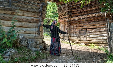 Artvin, Turkey - July 2018: Unidentified Woman In Local Outfit Walking In Maden Village , Savsat, Ar