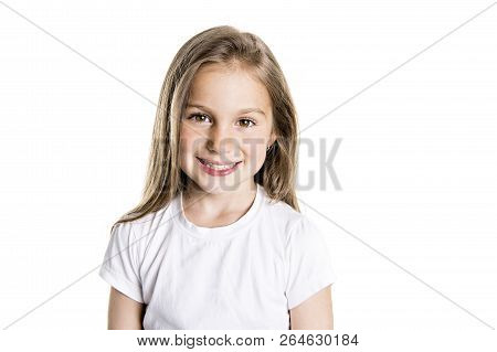 Portrait Of A Cute 7 Years Old Girl Isolated Over White Background