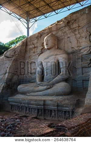 The Stone Image Of Buddha Gautama In Dhyana Mudra, Located In Gal Vihara Of The Area In The Neighbor