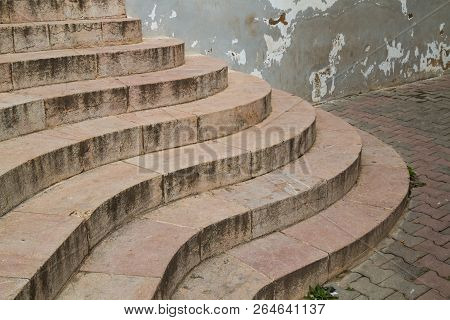 Marble Stairs Designed To A Curves. Entrance To A Building. Pavement With Cobblestones. Old Wall. Sa