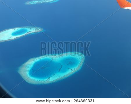 Maledives From Plane In The Water And Island