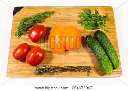 Vegetables Cucumbers Tomatoes Sweet Pepper Parsley Dill On A Wooden Board