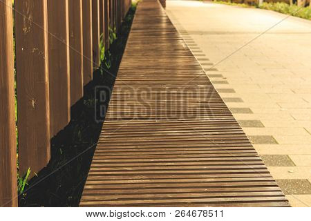 Wooden Bench In Perspective From Bars On The Street, Art Decor