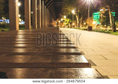 Wooden Bench In Perspective From Bars On The Street, Art Decor