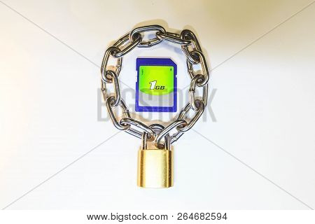 Sd Memory Card Protected By A Lock With A Chain