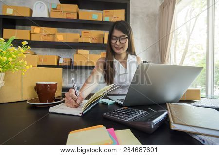 Young Asian Teenager Owner Business Woman Work At Home For Online Shopping, Writing The Order And Pr