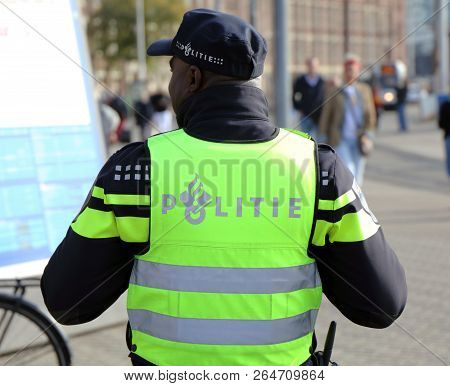 Dutch Police Officer In The Streets Of Amsterdam