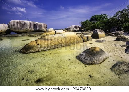 View Of A Group Of Big Stones On The Tanjung Tinggi Beach From Island Belitung/indonesia/
