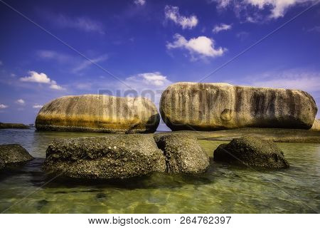 View Of A Group Of Big Stones On The Tanjung Tinggi Beach From Island Belitung/indonesia/