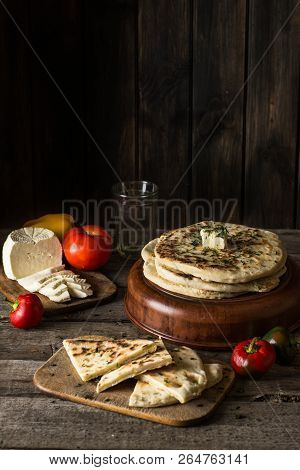 Pita Bread On Wooden Board With Feta Cheese And Tomatoes And Pepper. Still Life Of Food. Georgian Cu