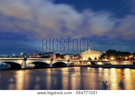 Paris River Seine with Pont de la Concorde and Assemblee Nationale at dusk