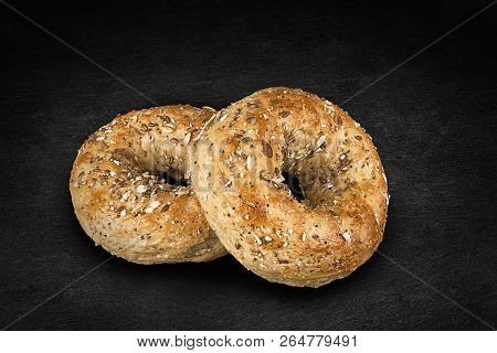 Fresh Multi-grain Bagel Bread, Isolated On A Natural Slate Stone In Background.