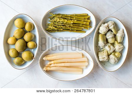 Pickled Vegetables Green And White Asparagus, Artichoke Heart And Unripe Green Almond Pickles In Pla