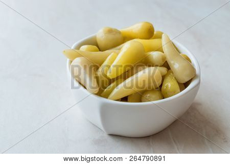 Pickled Green Pepper Pickles In Bowls.
