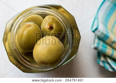 Pickled Unripe Green Almond Pickles In Glass Bottle Jar / Cagla Badem. Organic Food.
