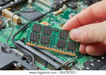 Installing memory module in a laptop computer
