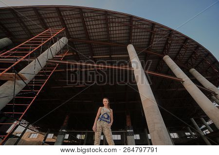 Girl In Suit On The Construction Site
