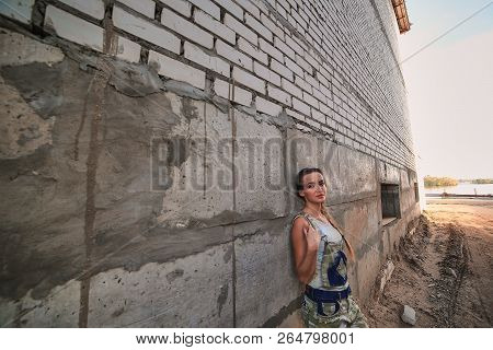 Girl In Suit On The Construction Site