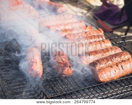 Romanian Mititei And Cooked On The Grill In The Smoke