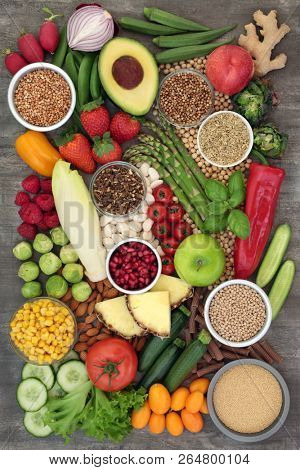 Alkaline super food selection with fresh vegetables, fruit, legumes, medicinal herbs and spice, pasta, grains and nuts. High in omega 3, antioxidants, anthocyanins, fibre, minerals and vitamins.  