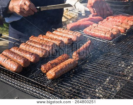 Romanian Mititei And Cooked On The Grill In The Smoke