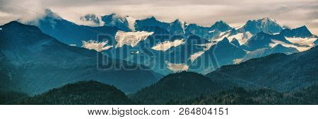 Alaska mountains inside passage nature landscape panoramic banner in summer at dusk - Glacier bay Mountain range, USA travel.