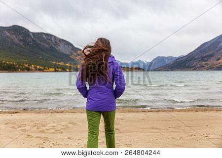 Yukon travel tourist woman walking on beach in Carcross, YUKON, Canada.