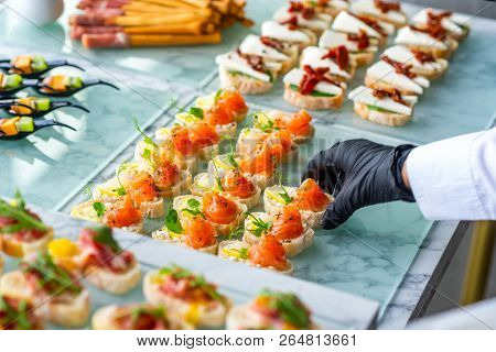 Cold Snacks With Cheese And Fish On The Table