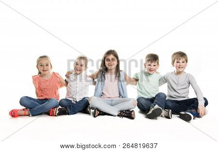 Group Of Five Young Children In Studio