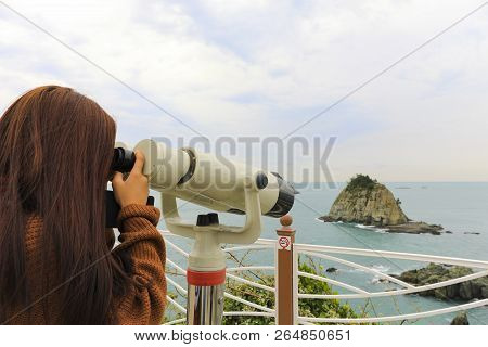 Binoculars. Young Girl Use Binocular Looking To The Island View At Oryukdo Islands In Busan, South K